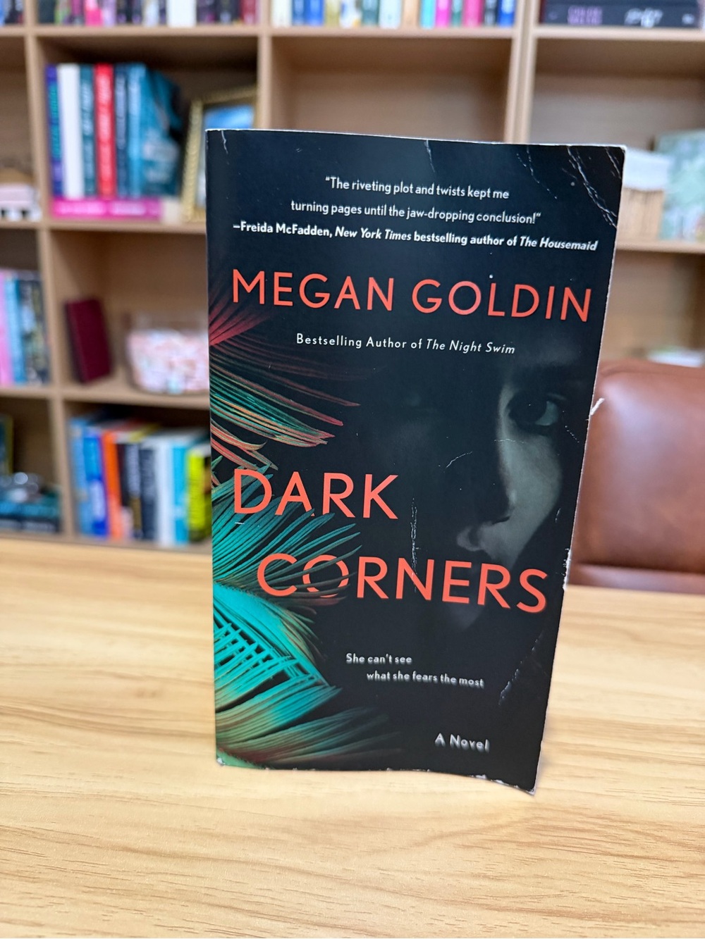 Megan Goldin "Dark Corners" Paperback Book - Black with Teal & Orange Cover